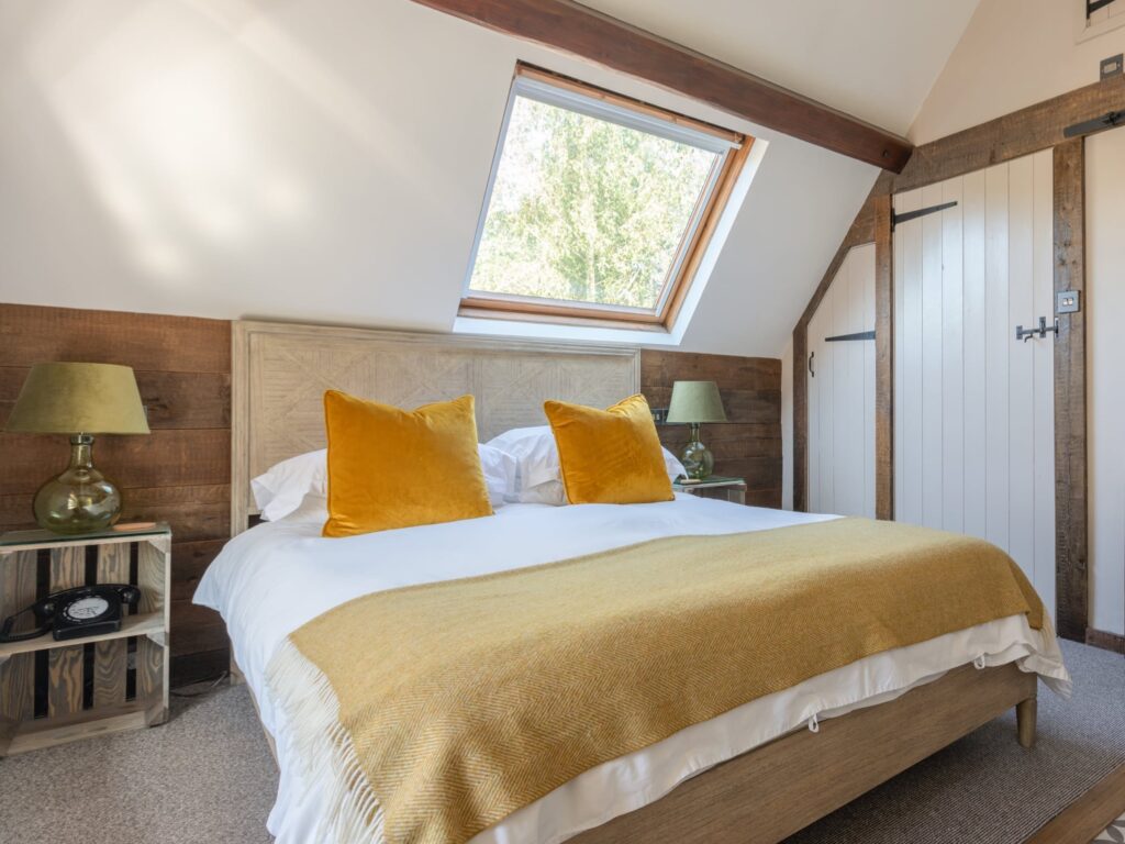 Bedroom in The Cottage Suite at the Tudor Farmhouse Hotel