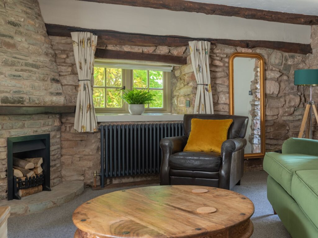 Living room in The Cottage Suite at the Tudor Farmhouse Hotel
